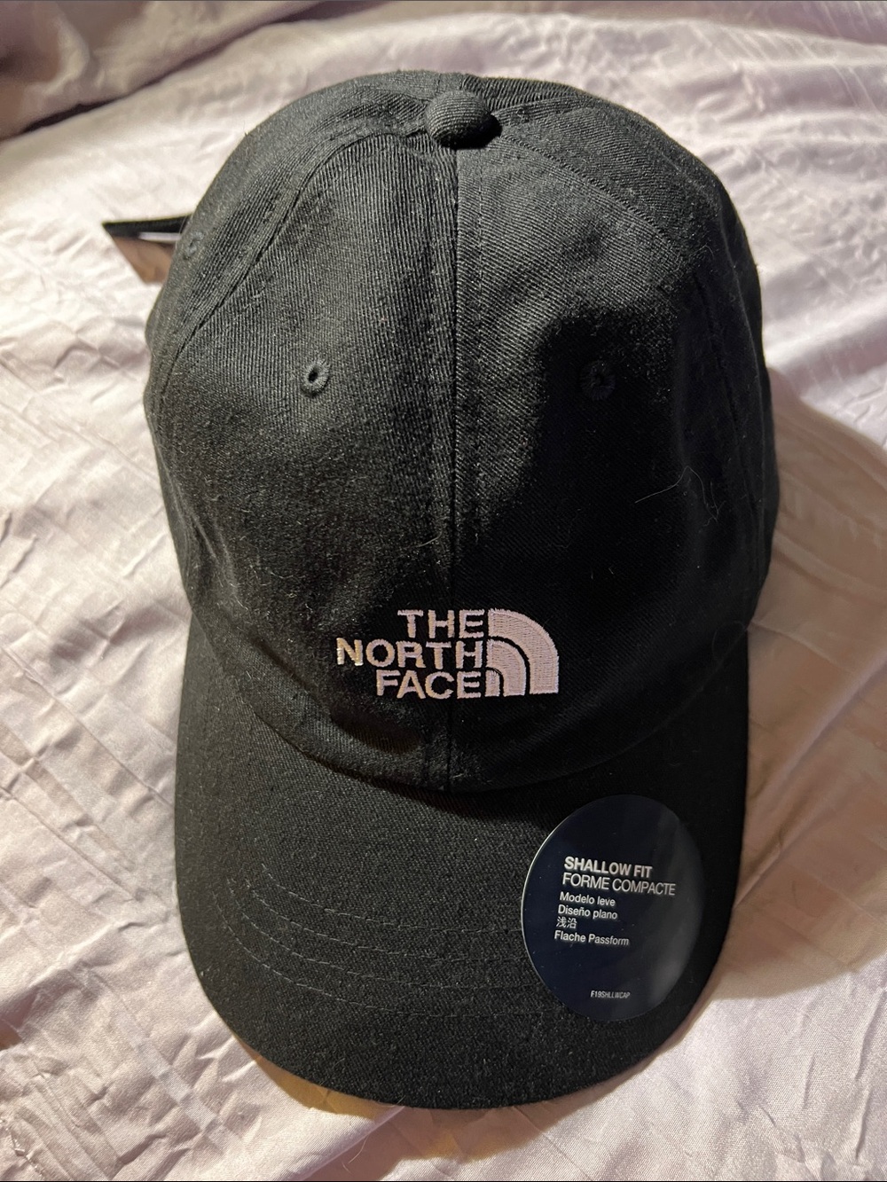 The North Face Black Cap with a white Logo New
